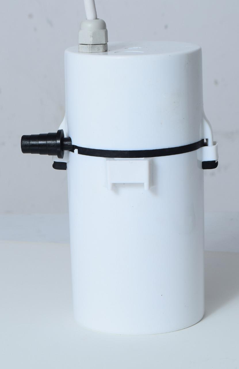 White cylindrical lampshade with black electrical cord on a light gray background