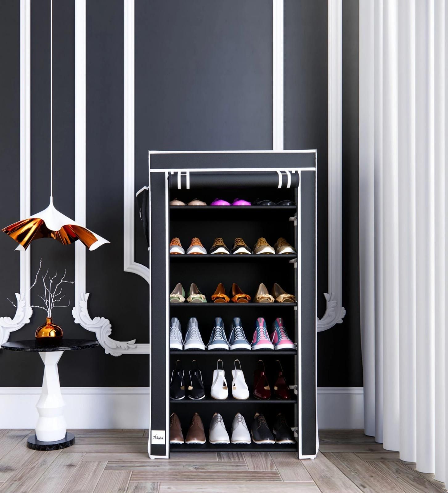 Shoe cabinet with shoes on shelves against a black and white striped wall.