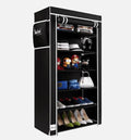 Black shoe cabinet with various items on a white background